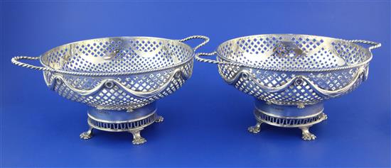 A pair of George V pierced silver two-handled sweetmeat bowls by William Hutton & Sons Ltd, 27 oz.